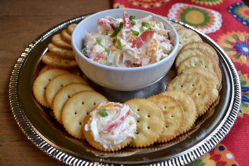 Mild Crab Dip in white bowl surrounded by crackers from www.ApronFreeCooking.com