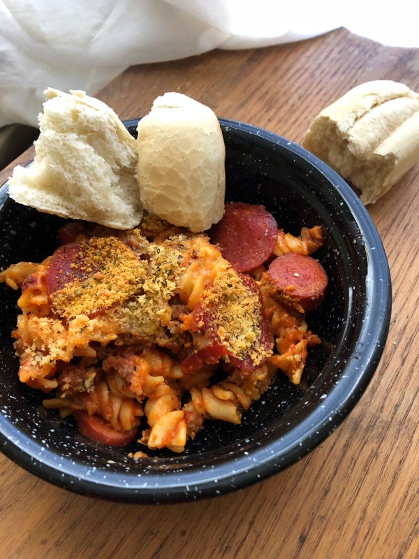 Black bowl of meat lovers pasta with bread on side from www.ApronFreeCooking.com 