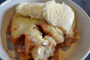 strawberry cream cheese cobbler with vanilla ice cream