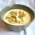 Broccoli Cheese soup in green bowl from www.ApronFreeCooking.com