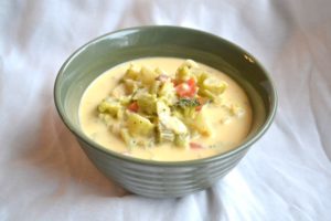 Broccoli Cheese soup in green bowl from www.ApronFreeCooking.com