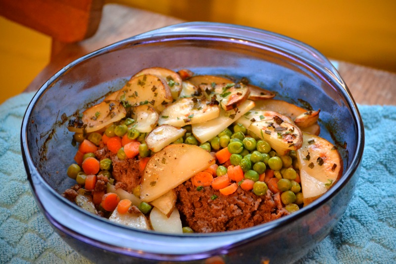 Traditional cottage pie with servings scooped out of dish from www.ApronFreeCooking.com