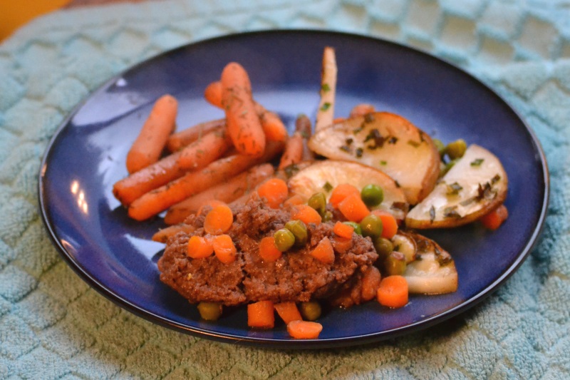 Cottage pie served on blue dish with roast carrots from www.ApronFreeCooking.com