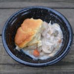 Chicken Pot Pie serving in black crockery bowl from www.ApronFreeCooking.com