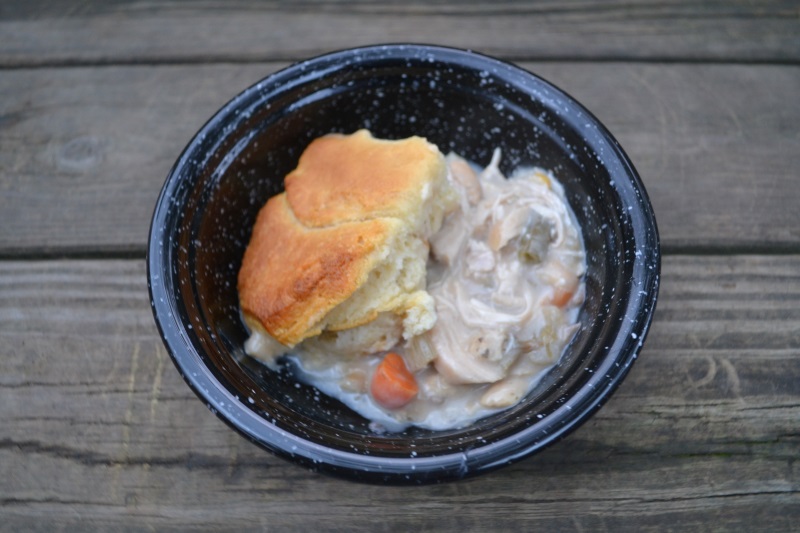 Chicken Pot Pie serving in black crockery bowl from www.ApronFreeCooking.com