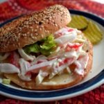 Easy Crab Salad Sandwich recipe served on a bagel from www.ApronFreeCooking.com