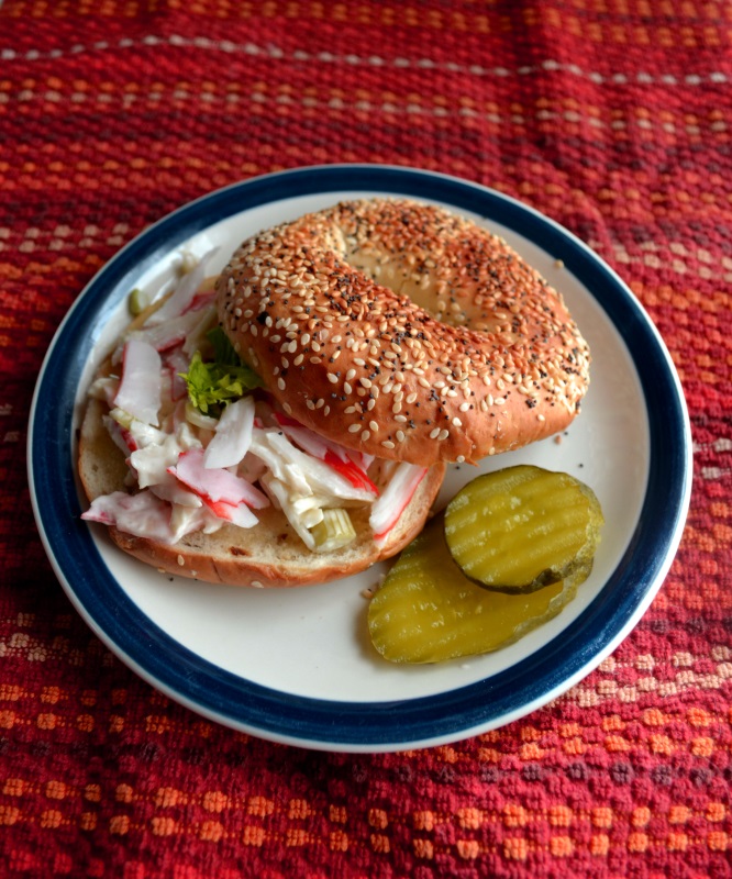 Easy Crab Salad Sandwich recipe served on a bagel from www.ApronFreeCooking.com