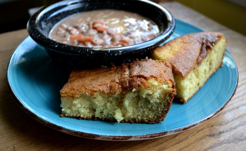 Lunch Lady Cornbread in a with bowl of bean soup. Make your inner 4th grader happy. from www.ApronFreeCooking.com
