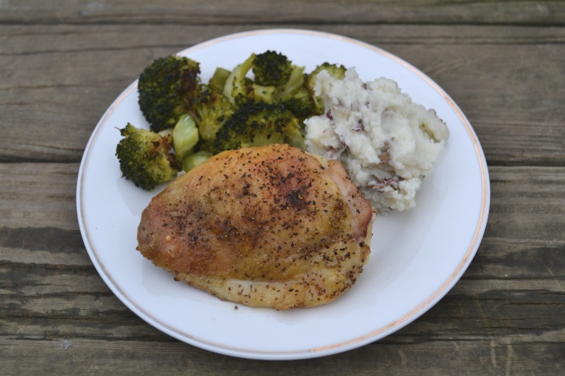 Roasted chicken thighs on white plate with broccoli and mashed potatoes from www.ApronFreeCooking.com