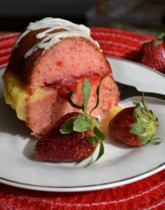 Strawberry Boston Cream Cake on white plate from www.ApronFreeCooking.com