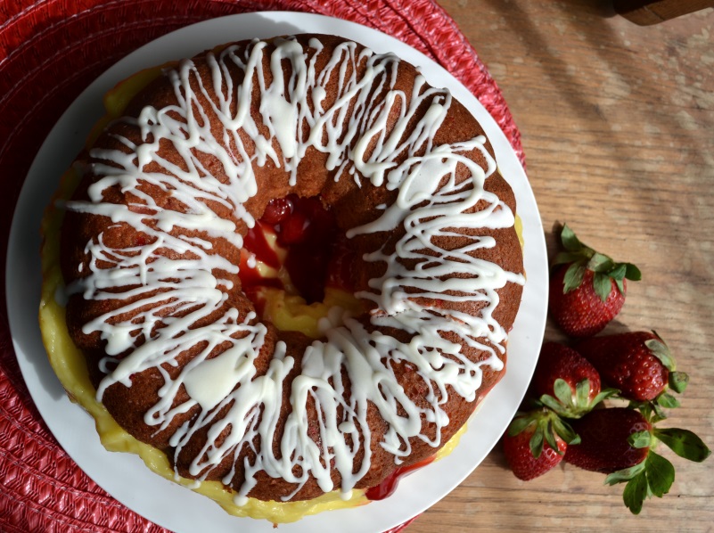 Strawberry Boston Cream Cake on white plate from www.ApronFreeCooking.com