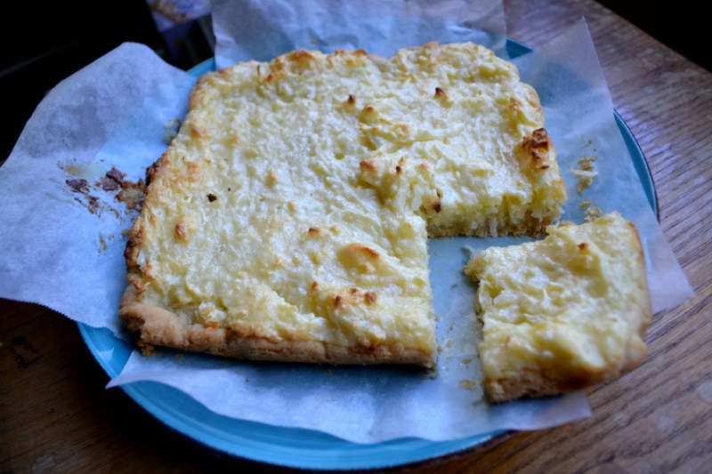 Coconut Cream Cheesecake with a square cut out from www.ApronFreeCooking.com