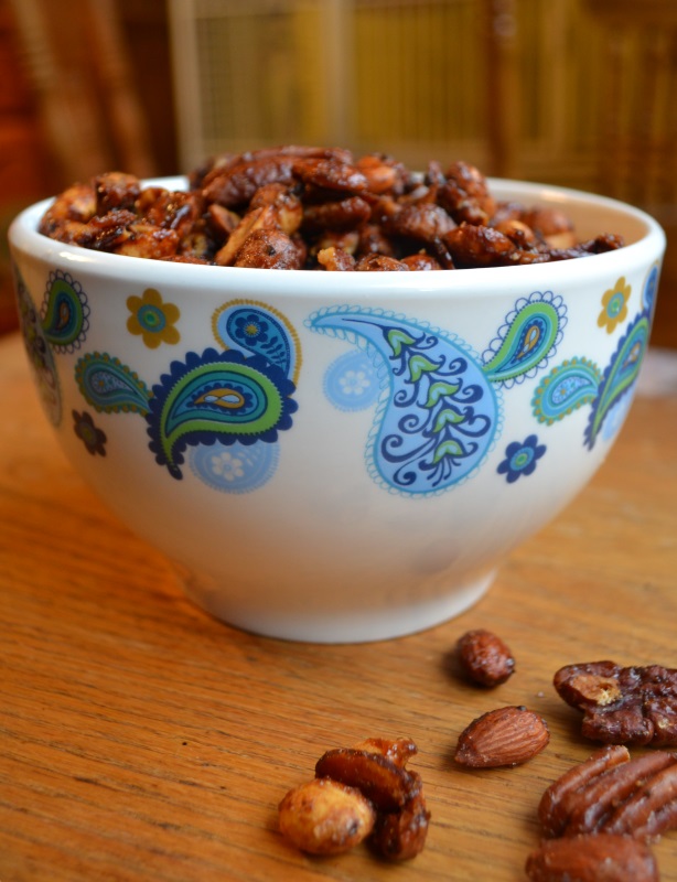 Coffee Glazed Nuts in white bowl with blue designs from www.ApronFreeCooking.com