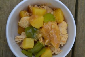 Pineapple Smothered Chicken with green peppers in white bowl from www.ApronFreeCooking.com