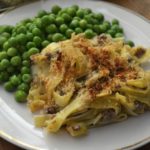 Grandma's Vintage Recipe for Noodle Casserole served with green peas from www.ApronFreeCooking.com