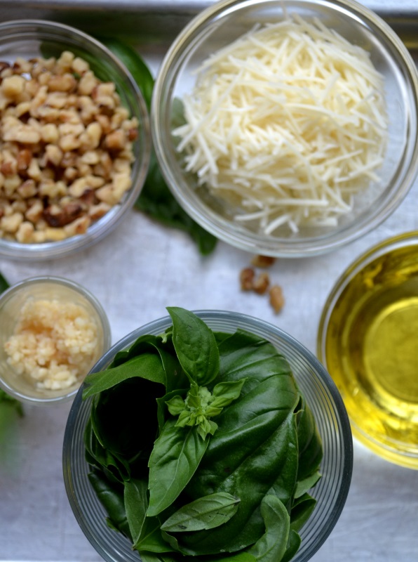 Walnut Basil Pesto ingredients gathered on silver tray from www.ApronFreeCooking.com