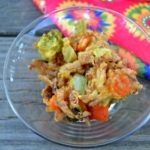 Single serving of Cheesy Vegetable Casserole in a clear glass bowl from www.ApronFreeCooking.com