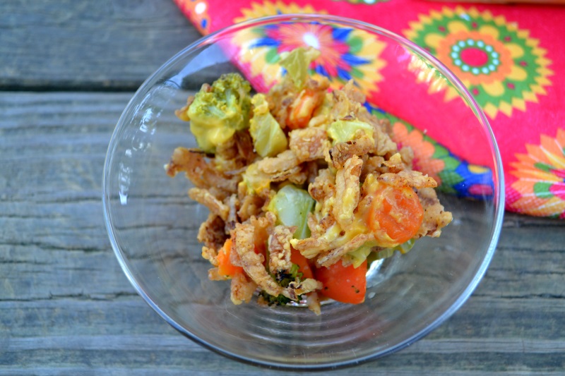 Single serving of Cheesy Vegetable Casserole in a clear glass bowl from www.ApronFreeCooking.com