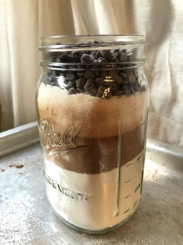 Death by Chocolate Mason Jar Cookies. Brown and white layers in a quart mason jar from www.ApronFreeCooking.com