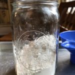 Mason Jar Brownies Flour poured into mason jar from www.ApronFreeCooking.com
