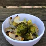 Single serving of Oven Roasted Broccoli in a white bowl from www.ApronFreeCooking.com