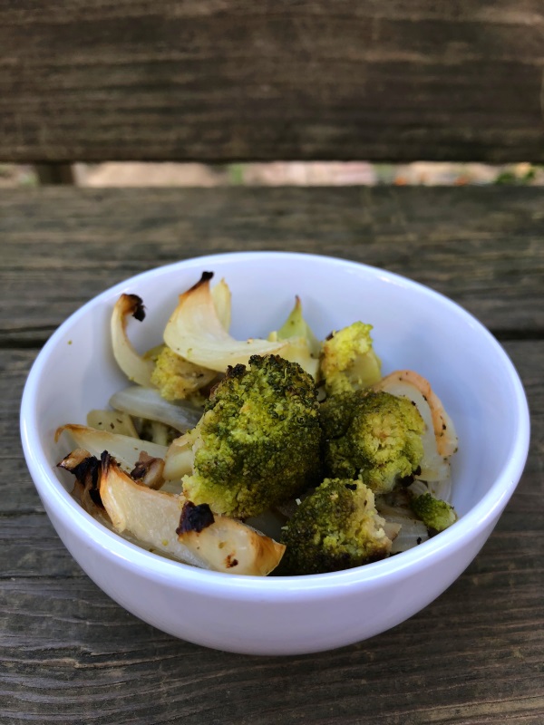 Single serving of Oven Roasted Broccoli in a white bowl from www.ApronFreeCooking.com
