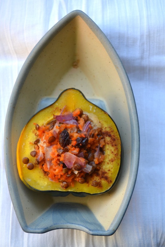 Single Stuffed Acorn Squash with rice and lentil pilaf in boat shaped bowl from www.ApronFreeCooking.com