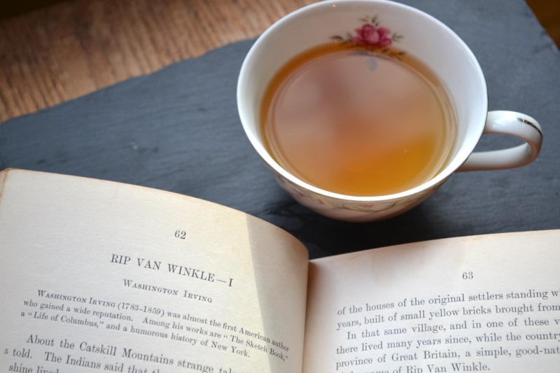 Sweet Dreams Tea in white tea cup beside a book, story titled Rip Van Winkle from www.ApronFreeCooking.com