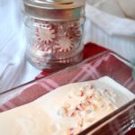 Vanilla Peppermint Creamer in glass dish with peppermints in background from www.ApronFreeCooking.com