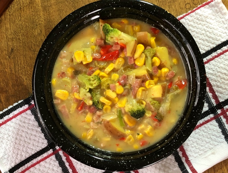 Vintage Farmhouse Chowder in a black bowl on white, red and blue cloth. from www.ApronFreeCooking.com