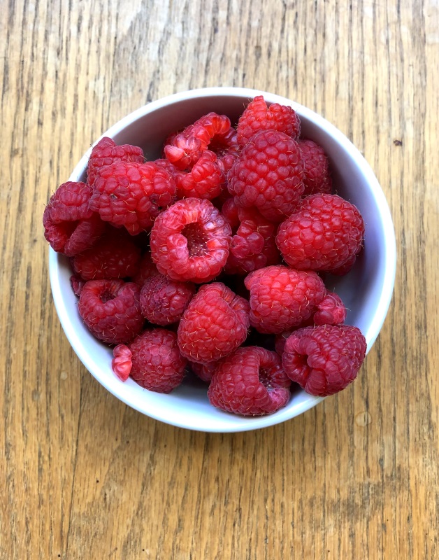 Red raspberries to top the white chocolate cheesecake from www.ApronFreeCooking.com