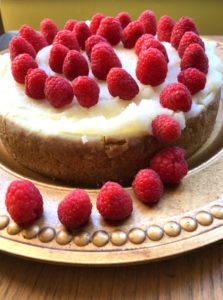 White Chocolate Raspberry Cheesecake on gold plate from www.ApronFreeCooking.com