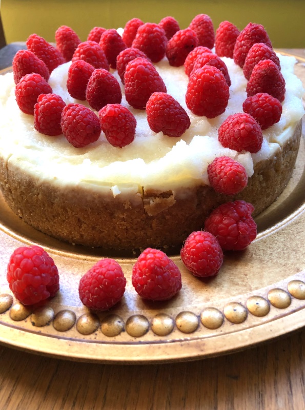 White Chocolate Raspberry Cheesecake on gold plate from www.ApronFreeCooking.com