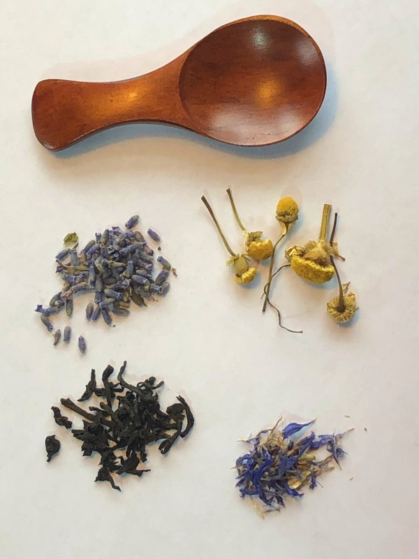 Blue Moon Tea Ingredients Earl Gray Tea, Lavender buds, Chamomile and blue cornflower petals on white background with wooden measuring spoon from www.ApronFreeCooking.com