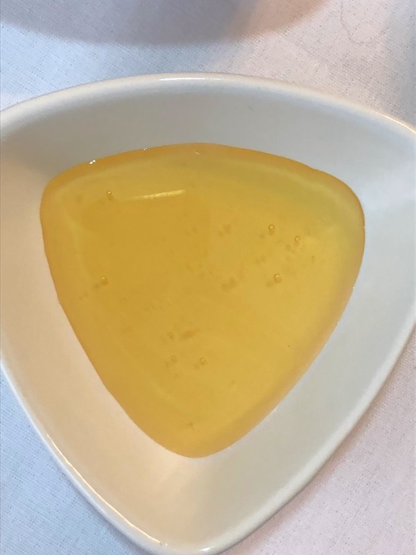 Golden honey in white bowl for lavender lemon tea from www.ApronFreeCooking.com