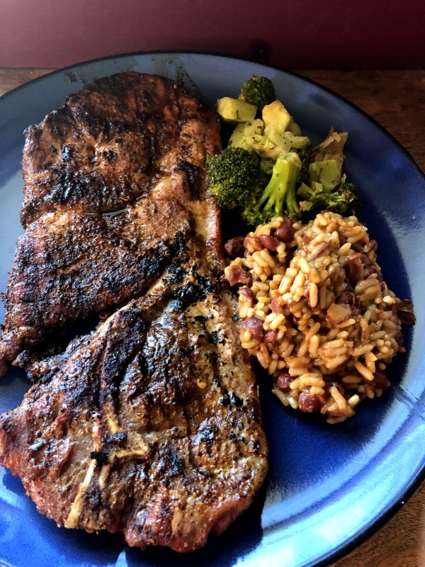 Taco Seasoned Grilled Steaks served with broccoli and beans & rice on blue plate from www.ApronFreeCooking.com