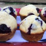 Blueberry Cornbread Muffins on a flag printed tray.