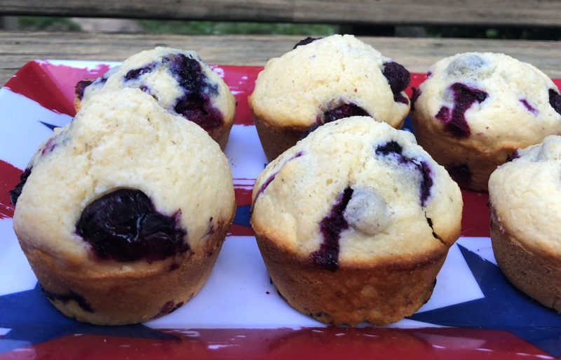 Blueberry Cornbread Muffins on a flag printed tray.