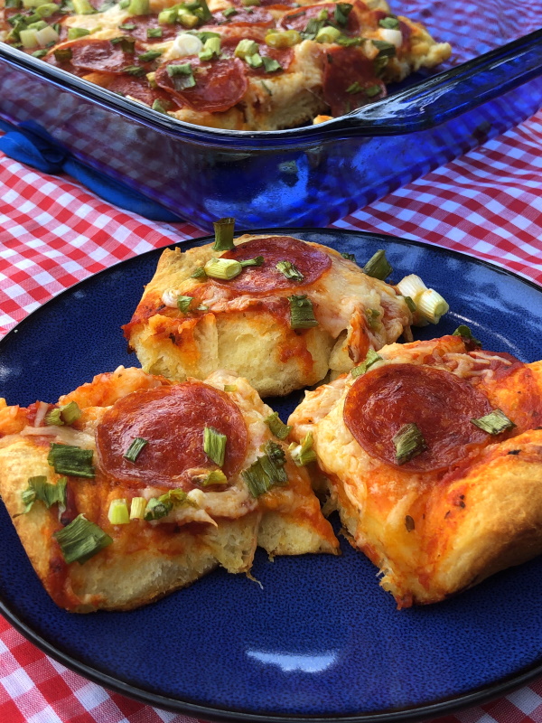 Easy biscuit pizza, topped with pepperoni and green onion