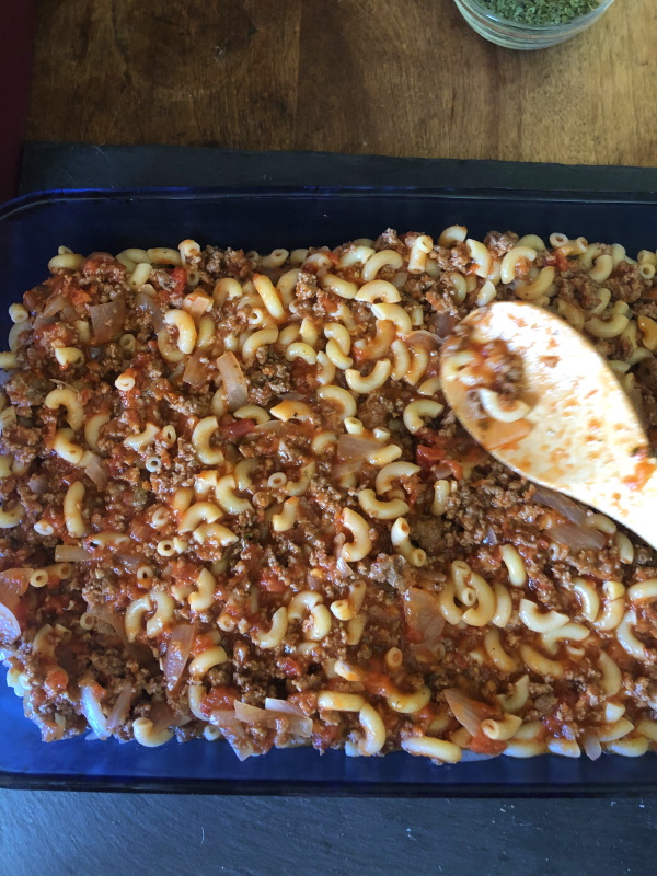 Johnny Marzetti Step 3 spread pasta mixture in casserole dish