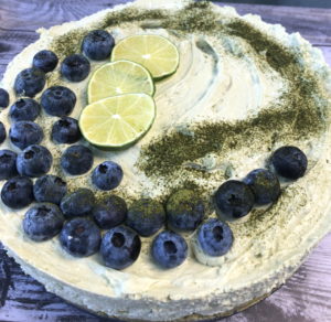 Matcha No Bake Cheesecake with blueberries and lime slices on top