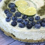Matcha no bake cheesecake with blueberry topping from the side so can see the crust