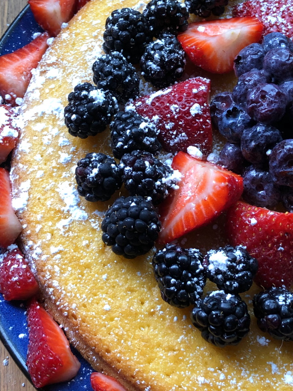 Fruit topped cake with strawberries, blackberries and blueberries