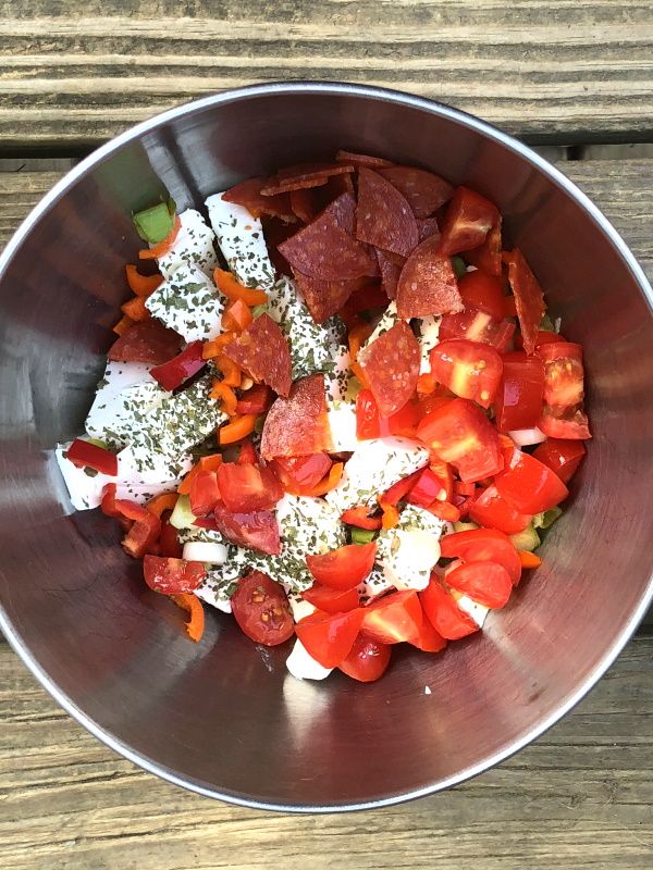 Pizza dip ingredients in bowl