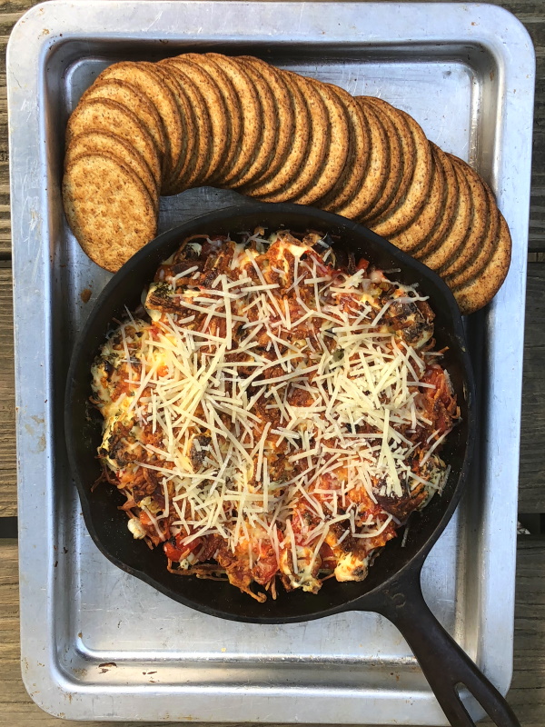 baked pizza dip in cast iron skillet