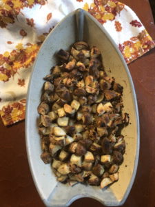 Herb Roasted Potatoes in ceramic boat shaped casserole dish