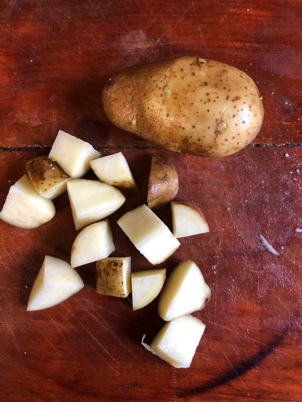 Diced potatoes on a cutting board