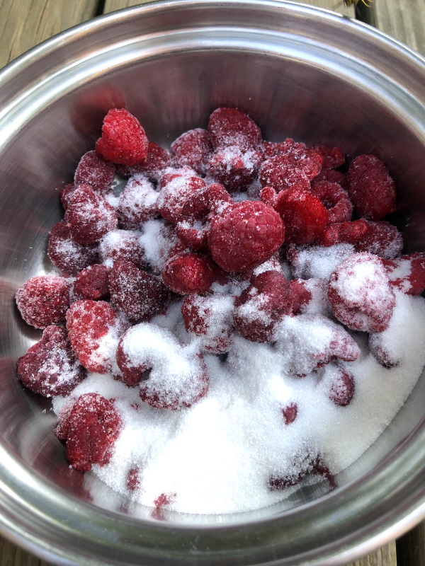 step 1 cooking homemade raspberry syrup in pan