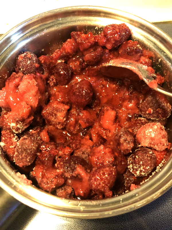 step 2 cooking homemade raspberry syrup in pan