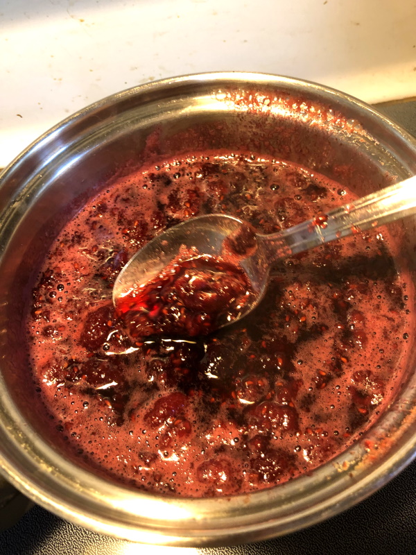 step 3 cooking homemade raspberry syrup in pan